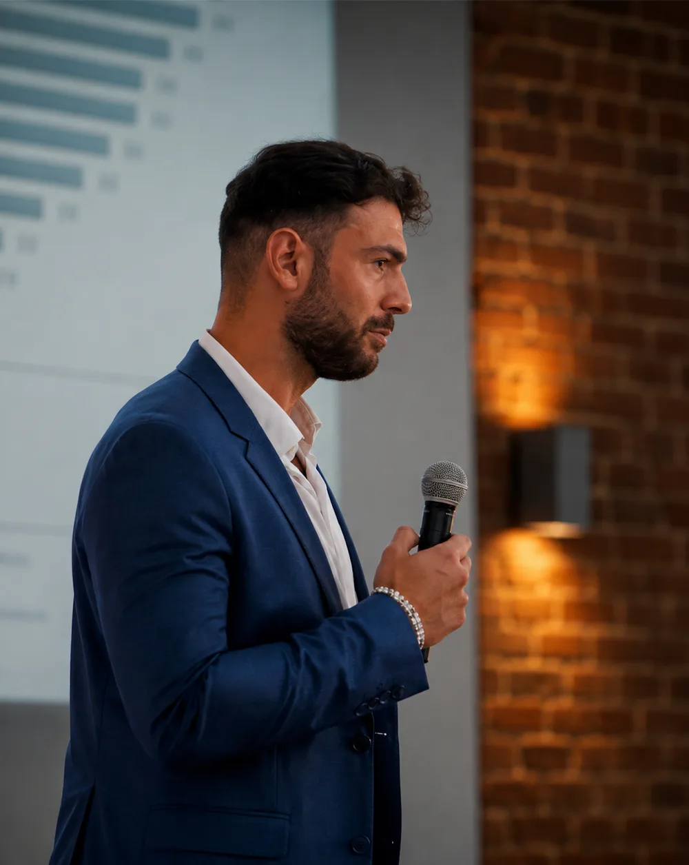 Ömer Dertlioglu, founder of SonicR1, speaking at an event